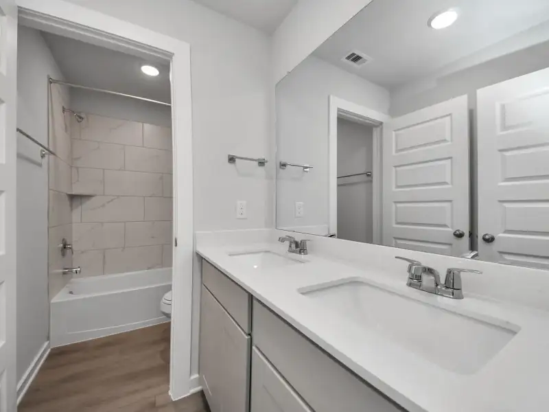 Furnished interior view inside a new home in Windmill Estates, Magnolia (Image 12).