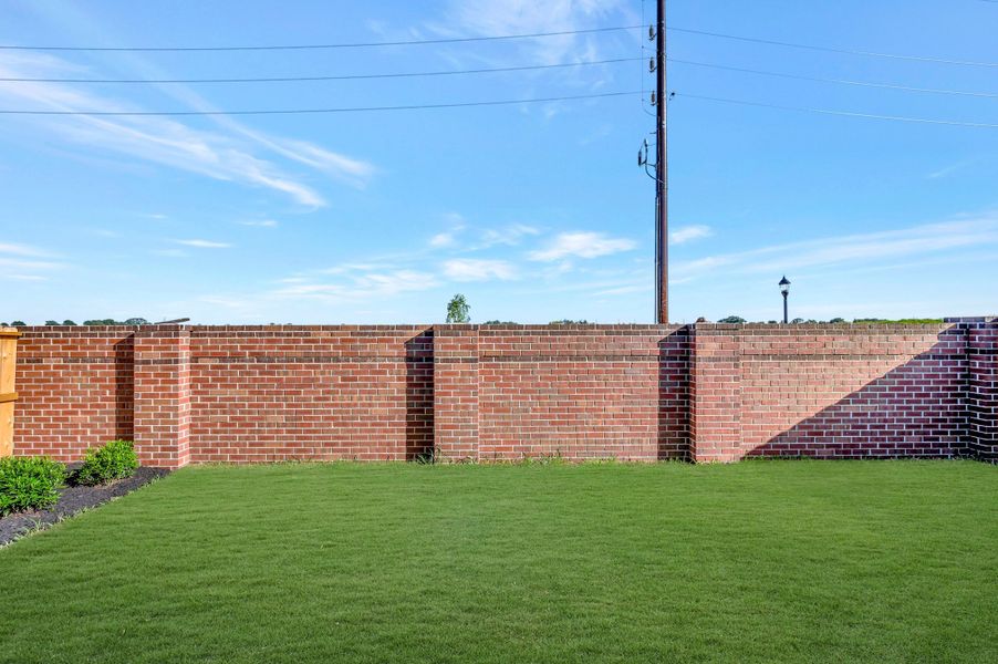 Exterior details and patio area of a home in Sienna - Grove Collection, Missouri City (Image 4).