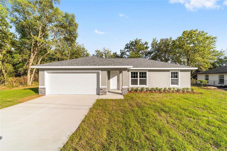 Front exterior of a new home in , Ocala, FL, highlighting curb appeal (Image 1). Front exterior of a new home in , Ocala, FL, highlighting curb appeal (Image 1).