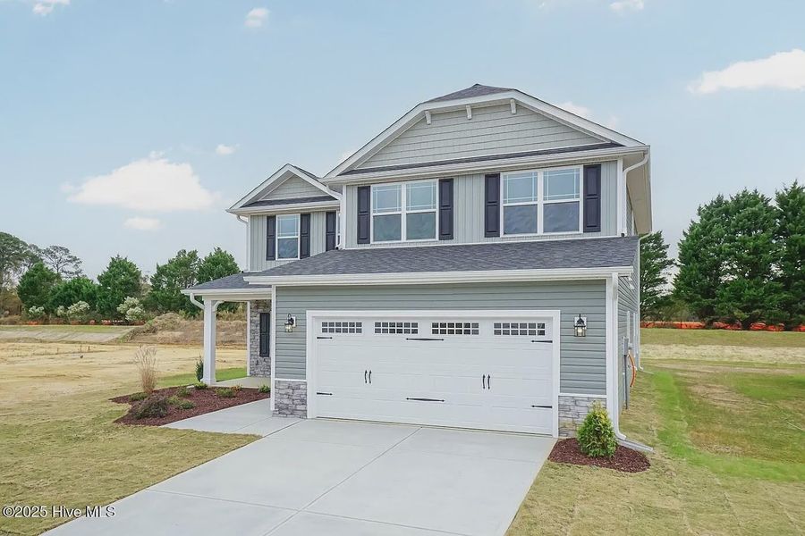 Front exterior of a new home in Williams Grove, Bailey, NC, highlighting curb appeal (Image 1).