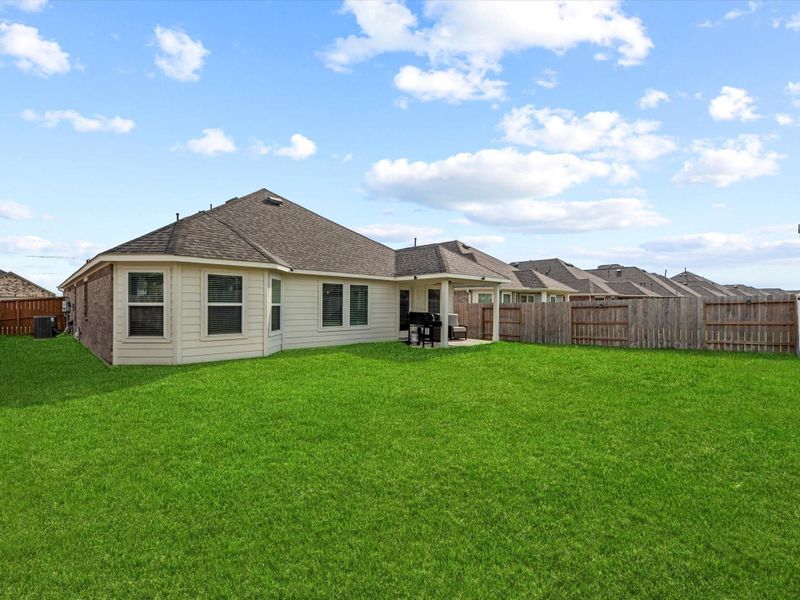 Large backyard with plenty of space to play or entertain.