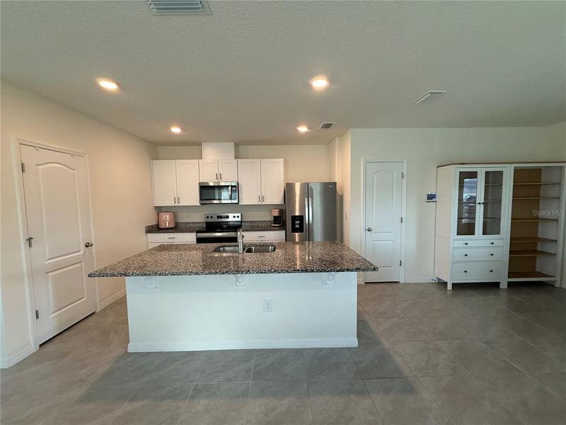 Furnished interior view inside a new home in Kindred, Kissimmee (Image 35).