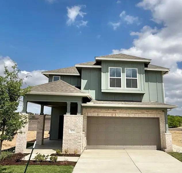 Front exterior of a new home in Porter Country, Buda, TX, highlighting curb appeal (Image 1). Front exterior of a new home in Porter Country, Buda, TX, highlighting curb appeal (Image 1).