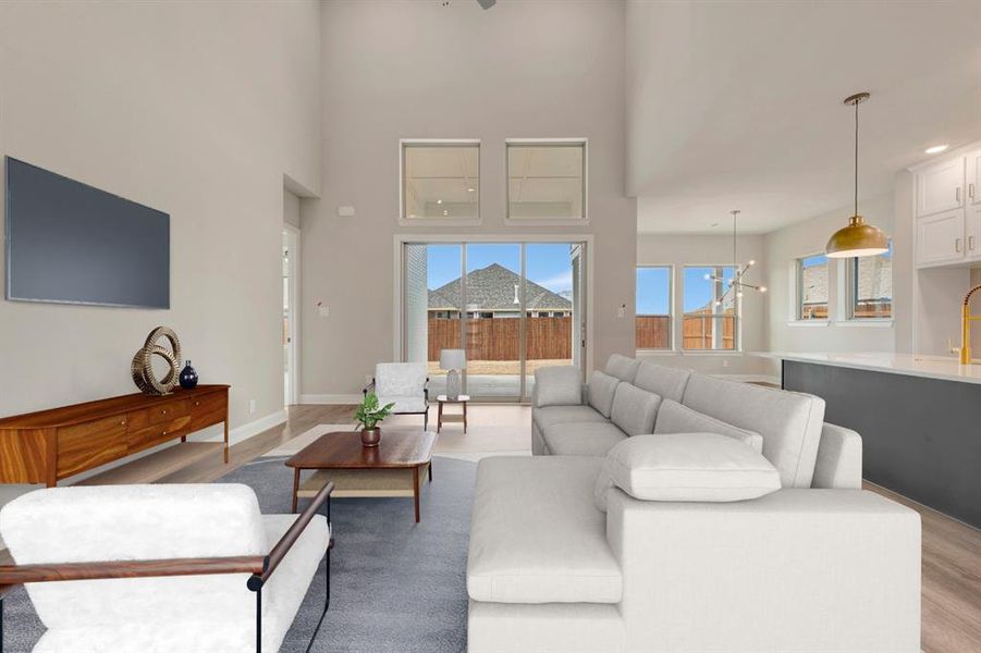 Living area featuring baseboards and wood finished floors