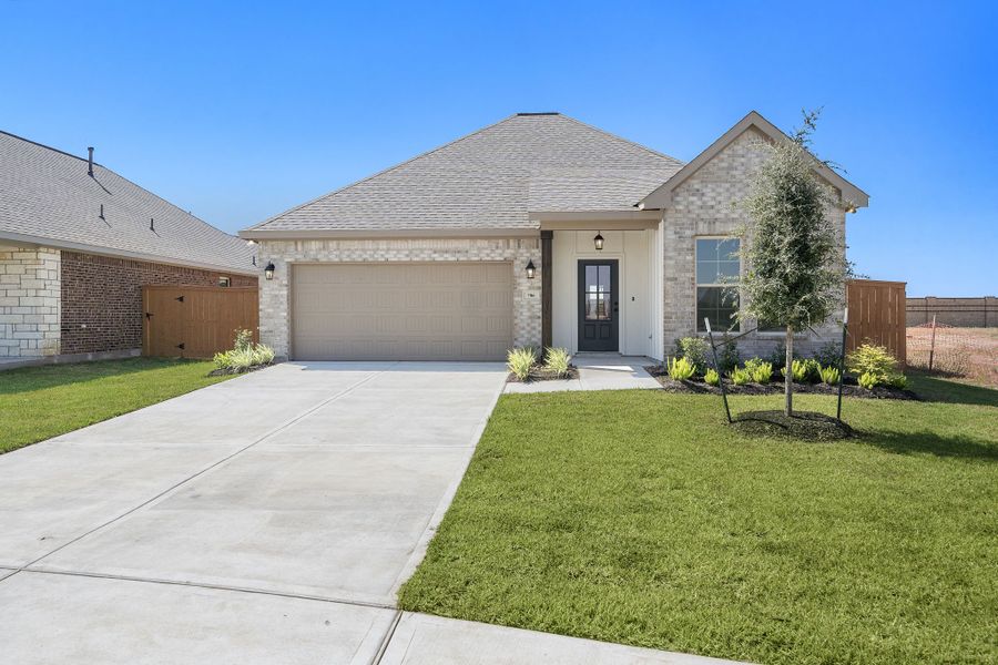 Front exterior of a new home in Emberly 55, Beasley, TX, highlighting curb appeal (Image 16). Front exterior of a new home in Emberly 55, Beasley, TX, highlighting curb appeal (Image 16).