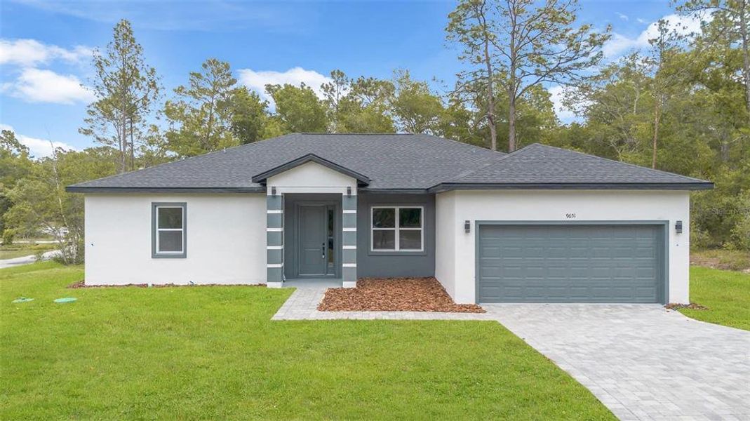 Front exterior of a new home in , Dunnellon, FL, highlighting curb appeal (Image 31).