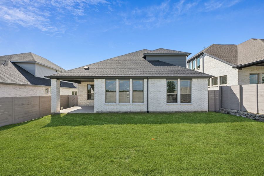 Covered Patio in the Wimbledon home plan by Trophy Signature Homes – REPRESENTATIVE PHOTO
