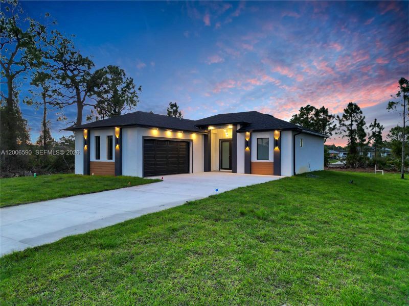 Front exterior of a new home in , Lehigh Acres, FL, highlighting curb appeal (Image 29).