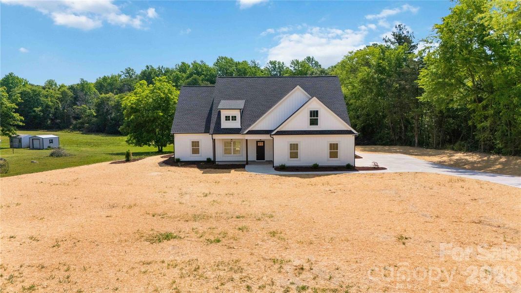Front exterior of a new home in , Clover, SC, highlighting curb appeal (Image 18).