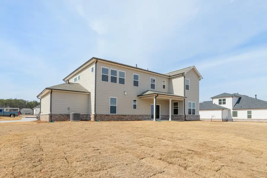 A house with a dirt lot. A house with a dirt lot.