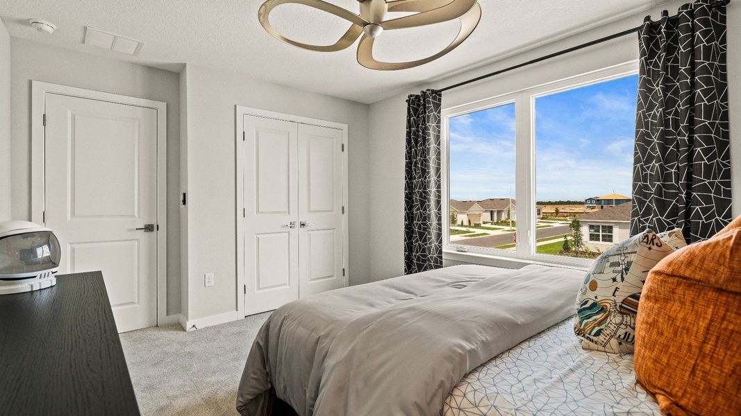 Third Bedroom with spacious closet in the Model Highbourne by DRB Homes in Hamilton Bluff located in Haines City, FL. Third Bedroom with spacious closet in the Model Highbourne by DRB Homes in Hamilton Bluff located in Haines City, FL.