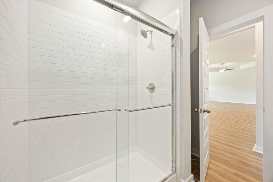 Oversized walk-in shower with glass doors. Oversized walk-in shower with glass doors.