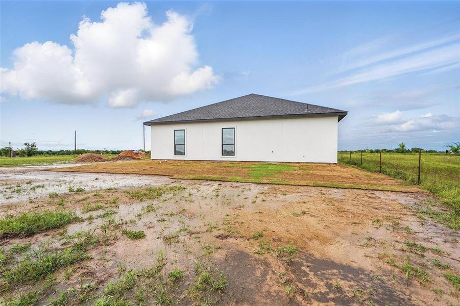 Rear view of property featuring fence Rear view of property featuring fence