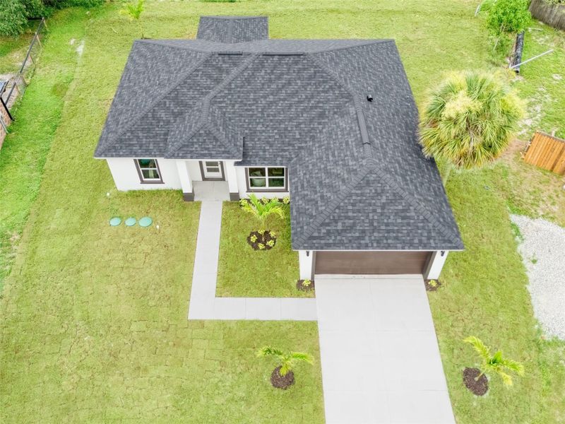 Front exterior of a new home in , Palm Bay, FL, highlighting curb appeal (Image 2).