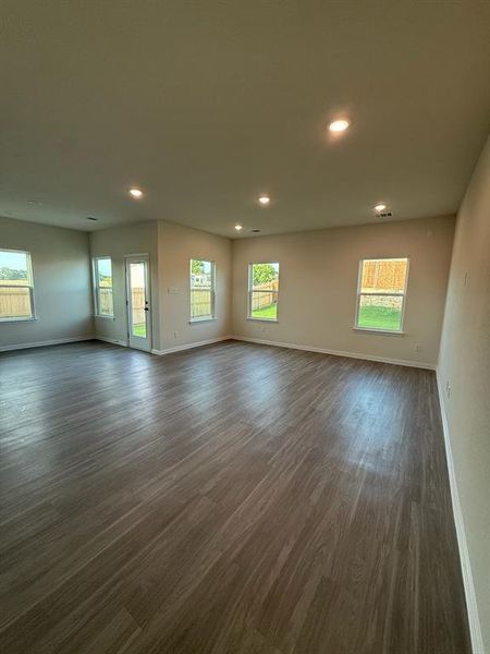 Unfurnished room featuring dark wood finished floors and recessed lighting Unfurnished room featuring dark wood finished floors and recessed lighting