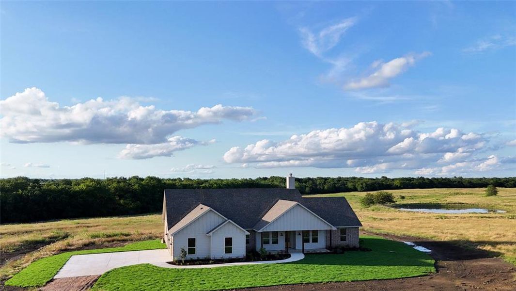 Front exterior of a new home in , Lone Oak, TX, highlighting curb appeal (Image 1). Front exterior of a new home in , Lone Oak, TX, highlighting curb appeal (Image 1).