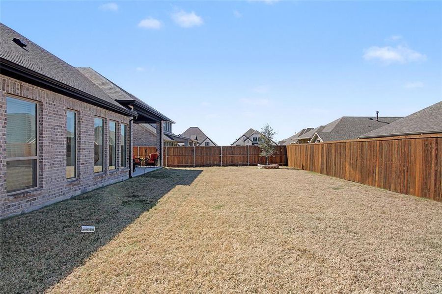 Exterior details and patio area of a home in Devonshire, Forney (Image 28).