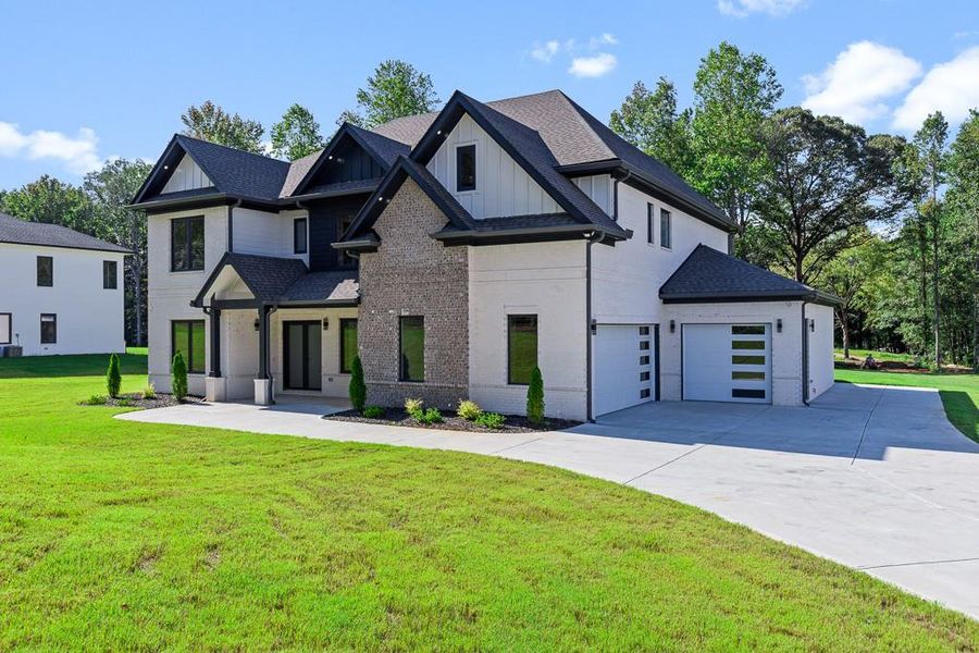 Front exterior of a new home in , Jefferson, GA, highlighting curb appeal (Image 1).