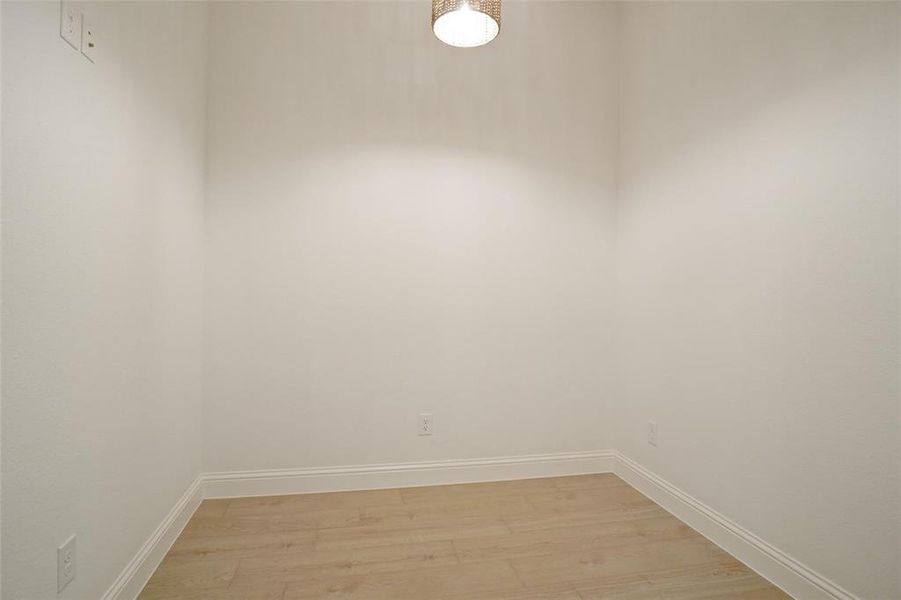 Unfurnished room featuring hardwood / wood-style flooring