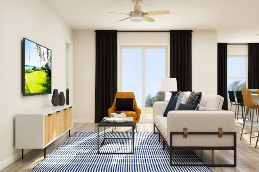 A living room with a couch and a table.