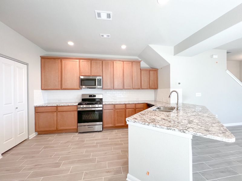 Representative furnished interior of a home built from the The Laura Belle Wallace II by Bigelow Homes in Creekside, Kyle (Image 7). Representative furnished interior of a home built from the The Laura Belle Wallace II by Bigelow Homes in Creekside, Kyle (Image 7).