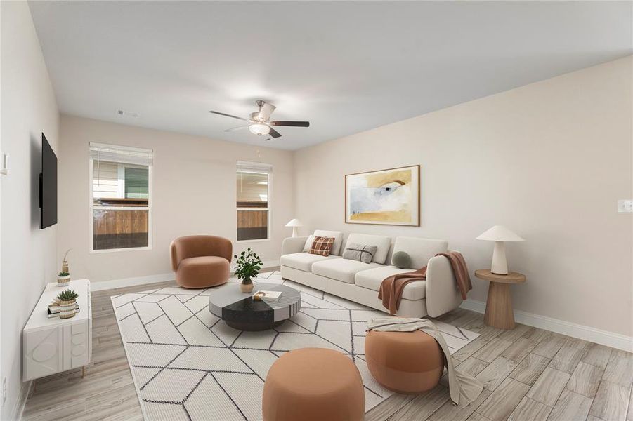Living room with light wood finished floors and a ceiling fan
