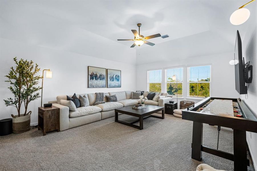 Another view of the upstairs living room. The space would also be a great game room or play room Another view of the upstairs living room. The space would also be a great game room or play room