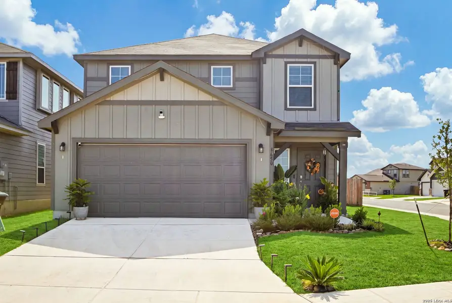 Front exterior of a new home in Red Hawk Landing, San Antonio, TX, highlighting curb appeal (Image 20). Front exterior of a new home in Red Hawk Landing, San Antonio, TX, highlighting curb appeal (Image 20).