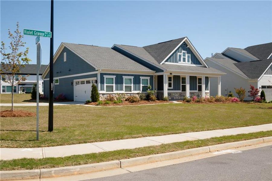 Front exterior of a new home in Sweetbay Farm, Lawrenceville, GA, highlighting curb appeal (Image 30).