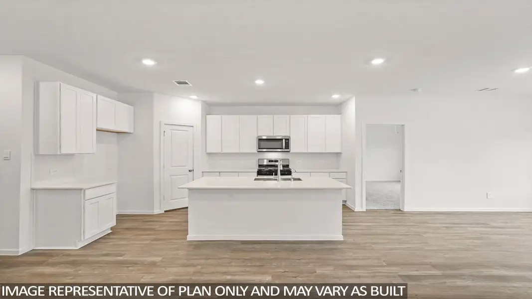 Furnished interior view inside a new home in Sunterra, Katy (Image 8).
