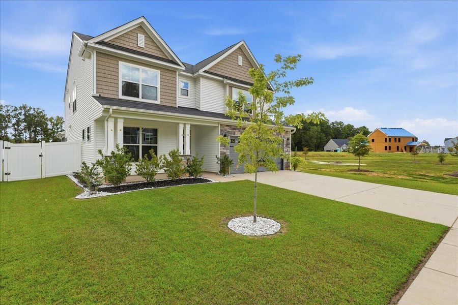Front exterior of a new home in , Ridgeville, SC, highlighting curb appeal (Image 30). Front exterior of a new home in , Ridgeville, SC, highlighting curb appeal (Image 30).