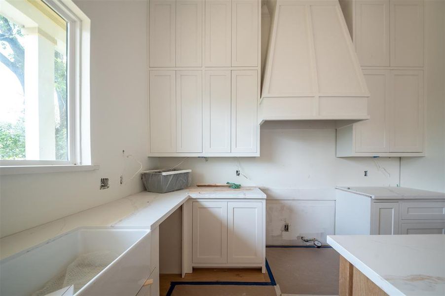 Farmhouse sink and picturesque window.