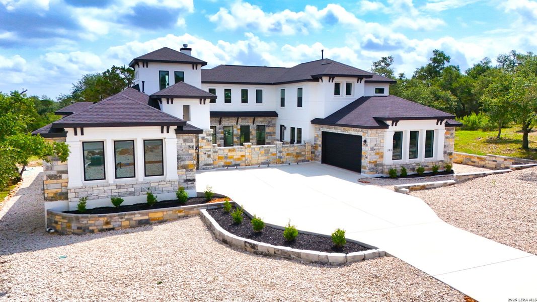 Front exterior of a new home in , New Braunfels, TX, highlighting curb appeal (Image 32).