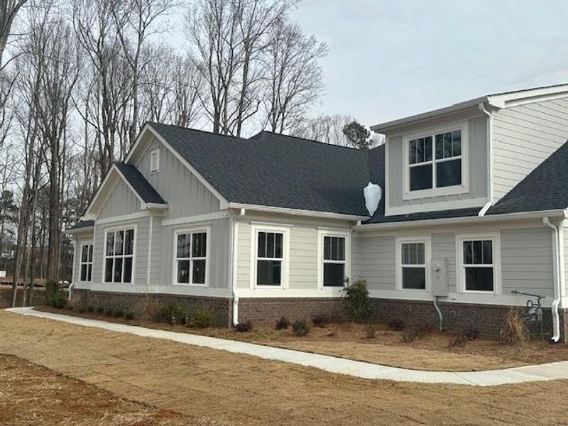 Front exterior of a new home in , Cumming, GA, highlighting curb appeal (Image 16).
