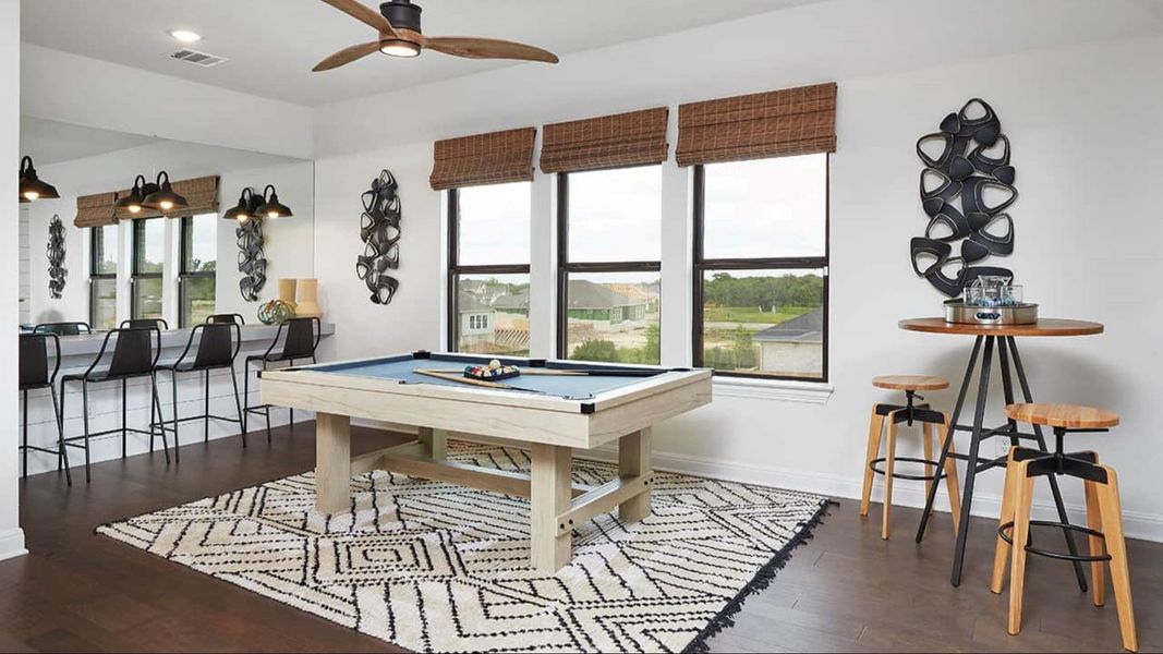 Game room with billiards, a ceiling fan, and dark wood-style floors