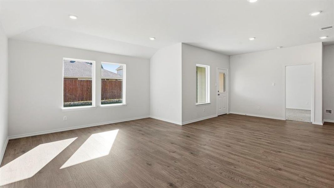 Unfurnished room with dark wood-style floors and recessed lighting Unfurnished room with dark wood-style floors and recessed lighting