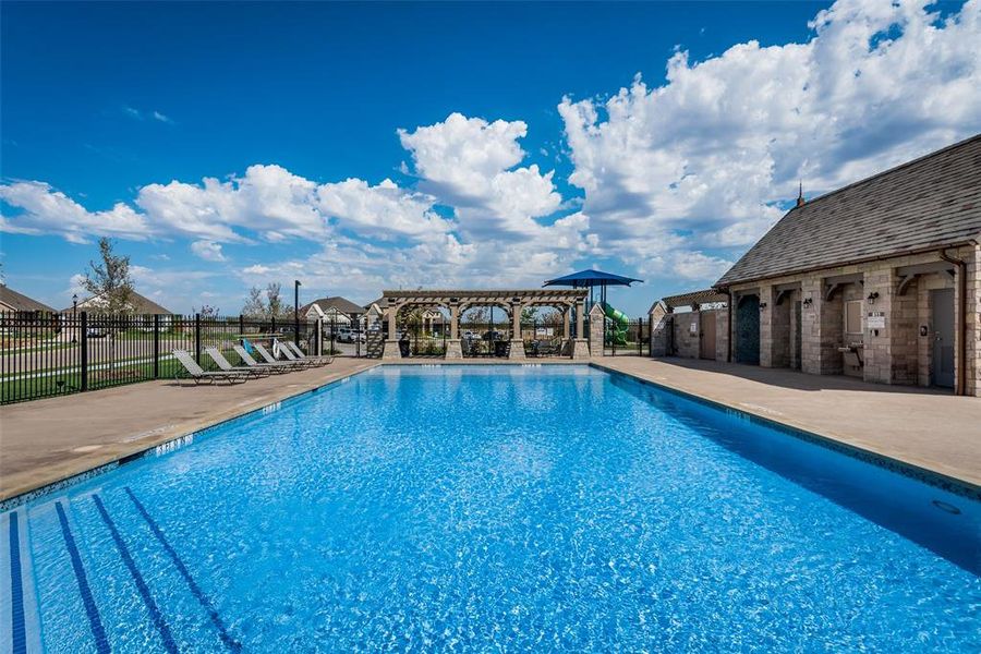 View of swimming pool with a pergola and a patio