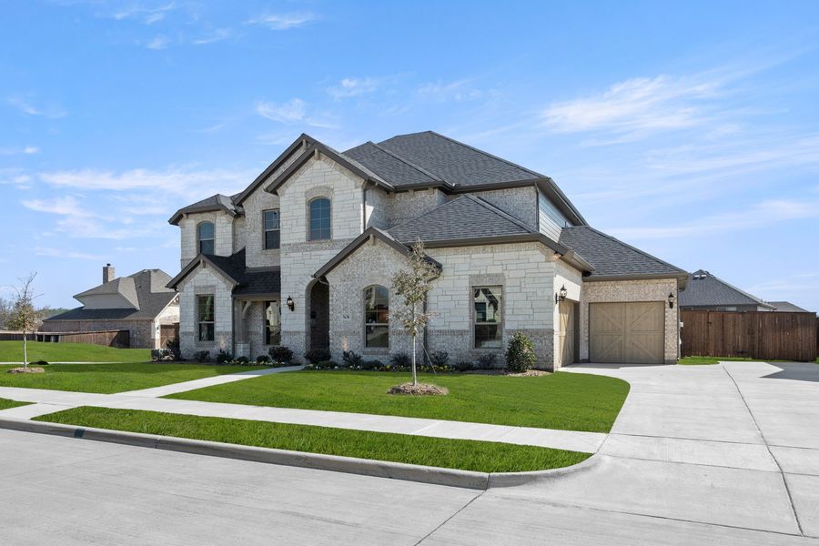 Front exterior of a new home in Hayes Crossing, Midlothian, TX, highlighting curb appeal (Image 2). Front exterior of a new home in Hayes Crossing, Midlothian, TX, highlighting curb appeal (Image 2).