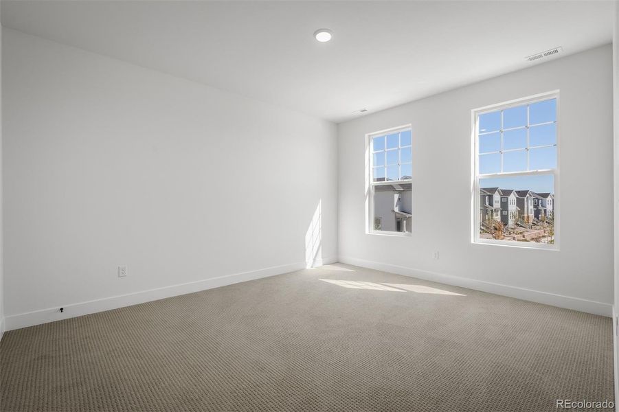 Spacious, unfurnished interior of a new home in Revel Crossing at Wolf Ranch - The Panorama Collection, Colorado Springs (Image 40).