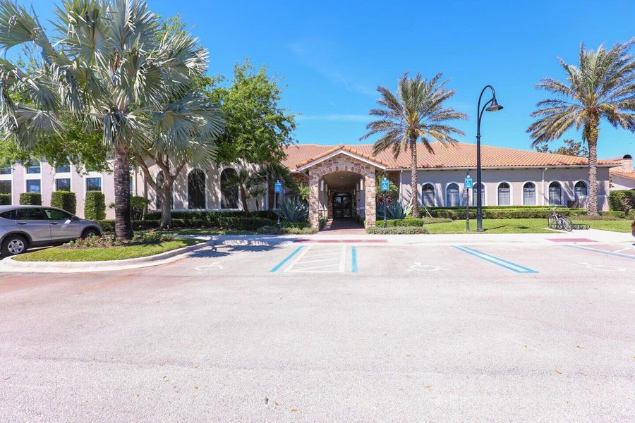 Front exterior of a new home in PGA Village Verano, Port St. Lucie, FL, highlighting curb appeal (Image 31).