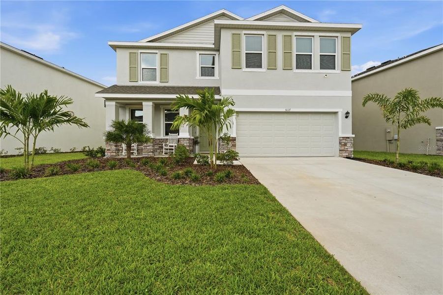 Front exterior of a new home in Solera at Lakewood Ranch, Lakewood Ranch, FL, highlighting curb appeal (Image 24). Front exterior of a new home in Solera at Lakewood Ranch, Lakewood Ranch, FL, highlighting curb appeal (Image 24).