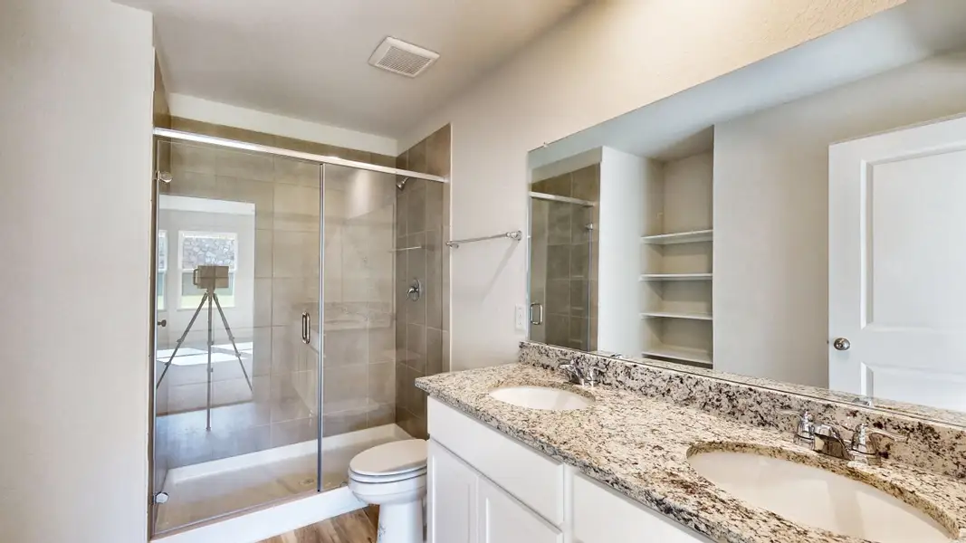 A bathroom with a glass shower.