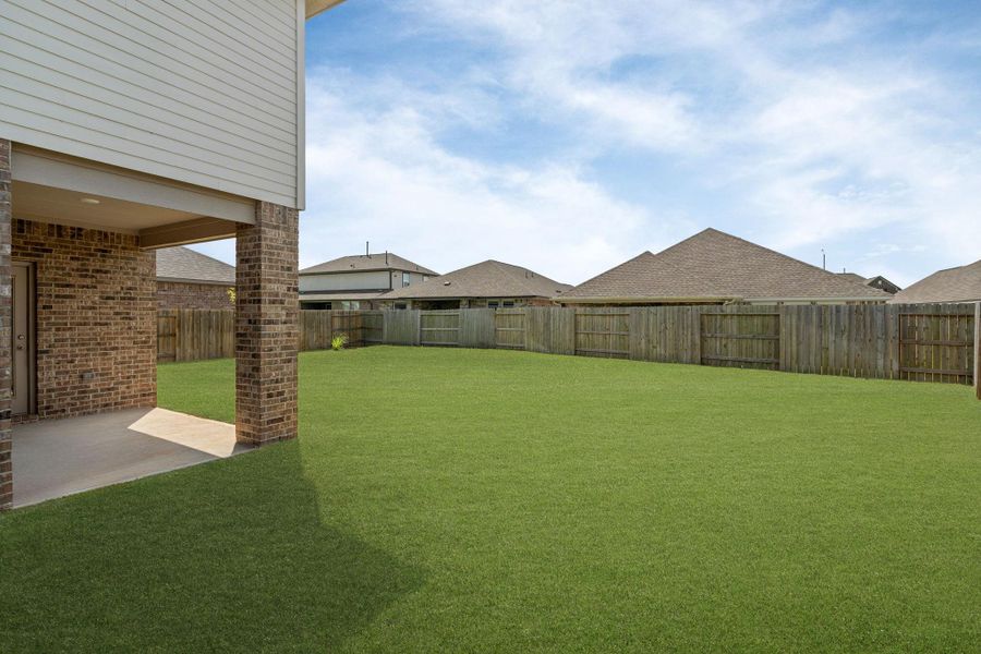 Exterior details and patio area of a home in Sunterra, Katy (Image 25).