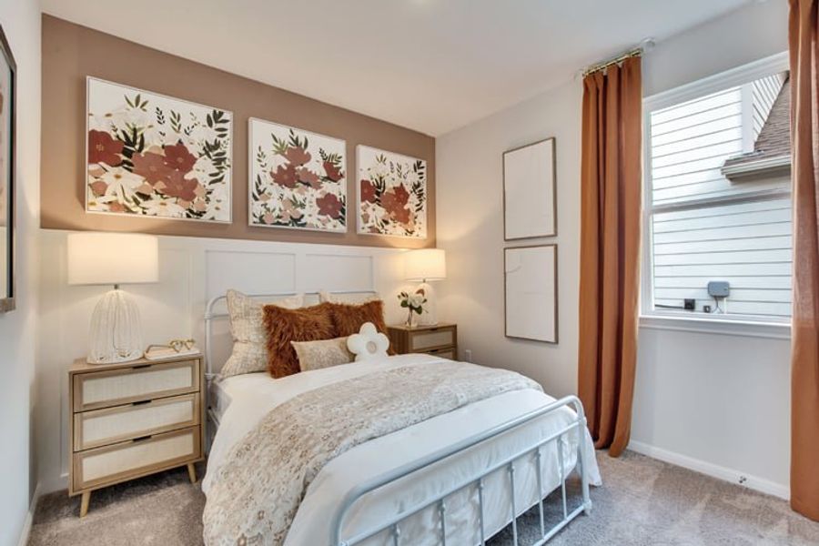 A bedroom with a bed and lamps. A bedroom with a bed and lamps.