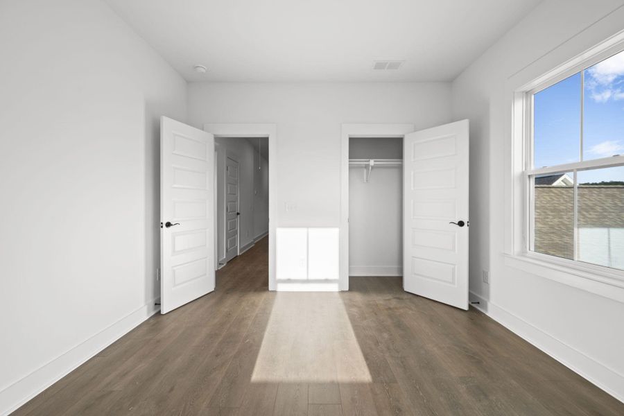 Spacious, unfurnished interior of a new home in The Domus Collection at Midtown Nexton, Summerville (Image 32).