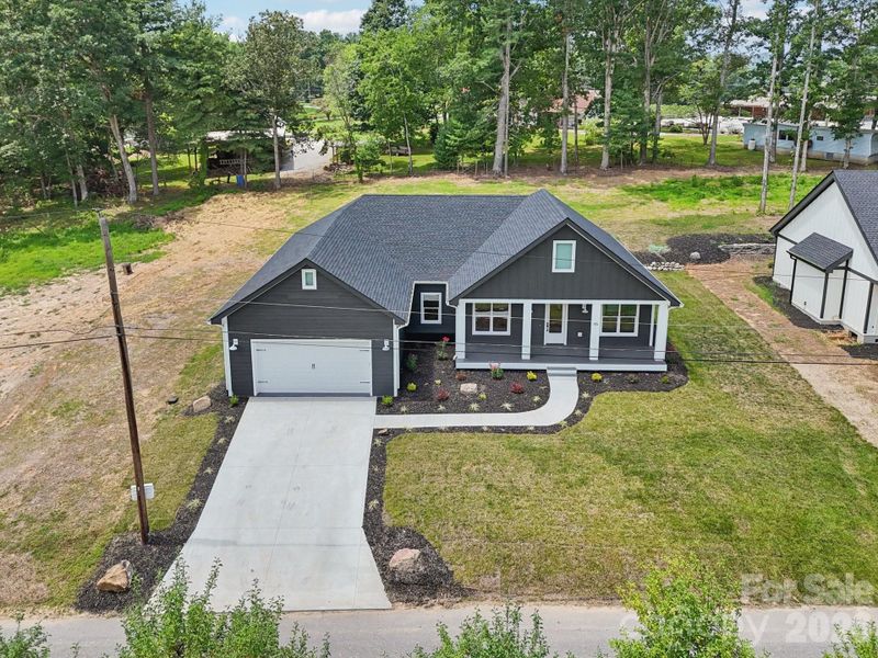 Front exterior of a new home in , Hendersonville, NC, highlighting curb appeal (Image 25).
