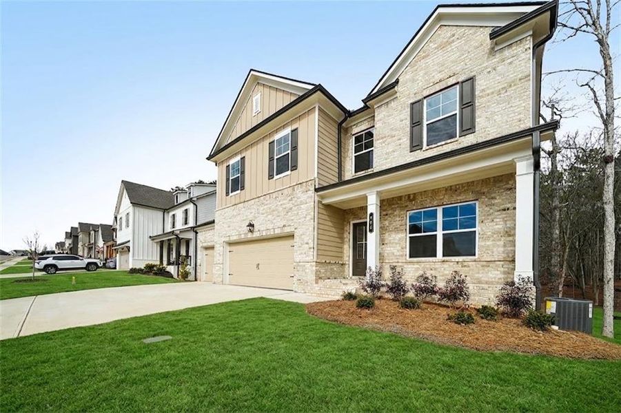 Front exterior of a new home in Rosewood Lake Estates, Hoschton, GA, highlighting curb appeal (Image 32). Front exterior of a new home in Rosewood Lake Estates, Hoschton, GA, highlighting curb appeal (Image 32).