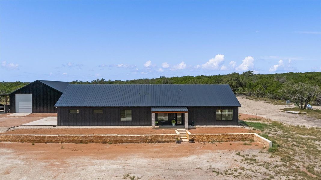 View of front facade with a porch and a metal roof View of front facade with a porch and a metal roof