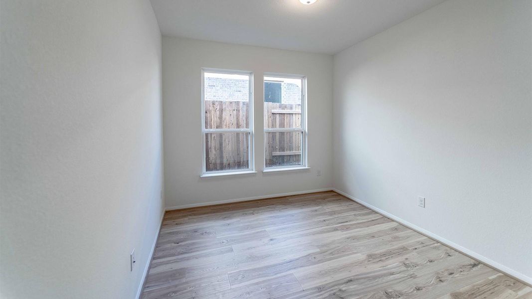 Spare room featuring light wood-style flooring