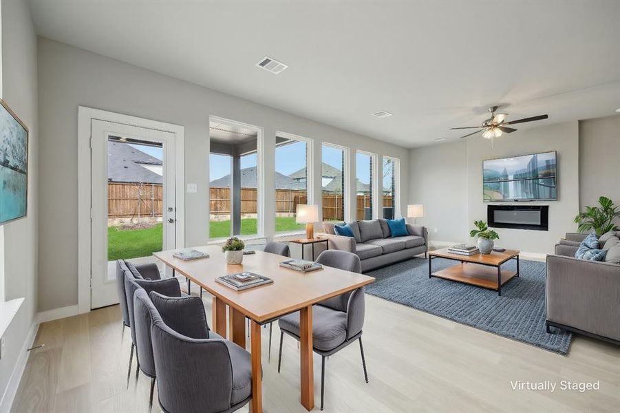 Virtually staged breakfast room and living room